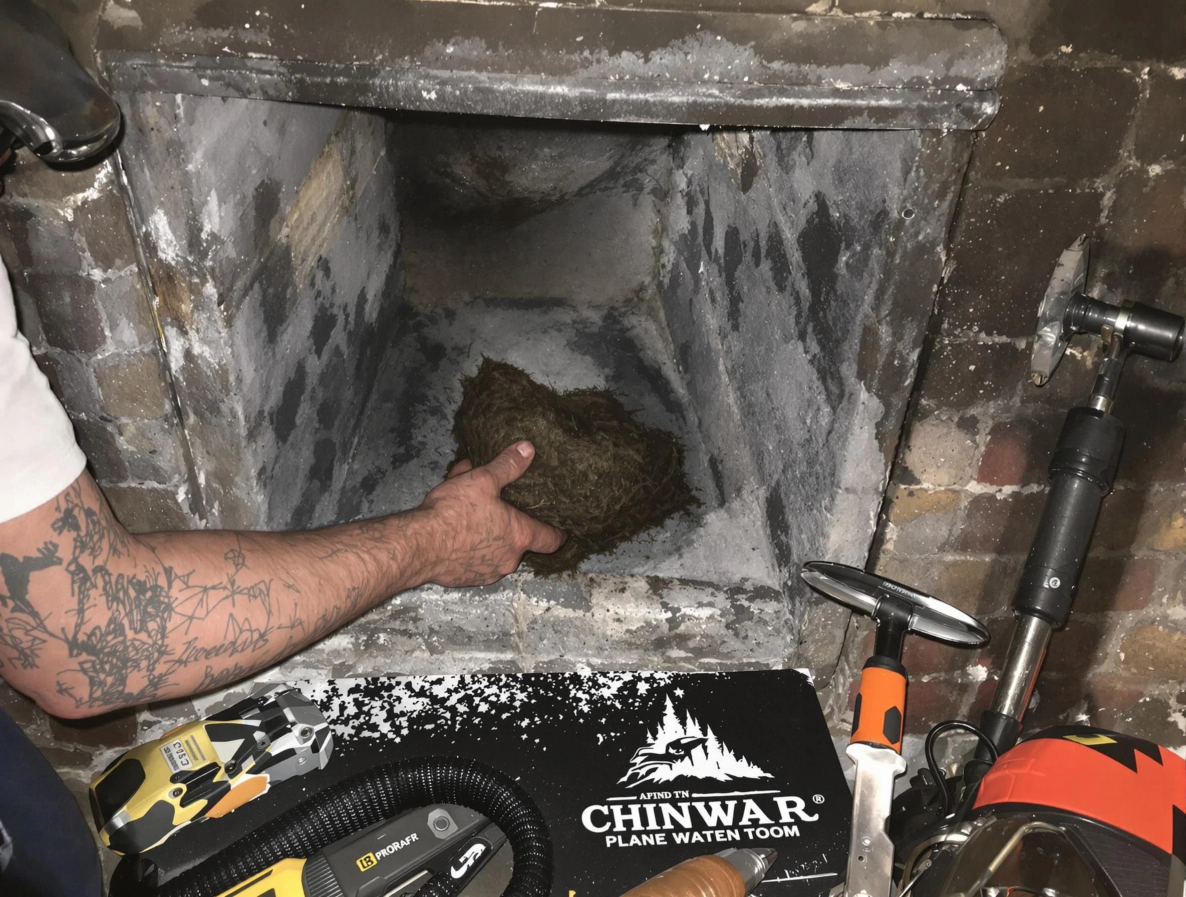 Framingham Chimney Sweep safely removing debris and screening chimney in Framingham, MA