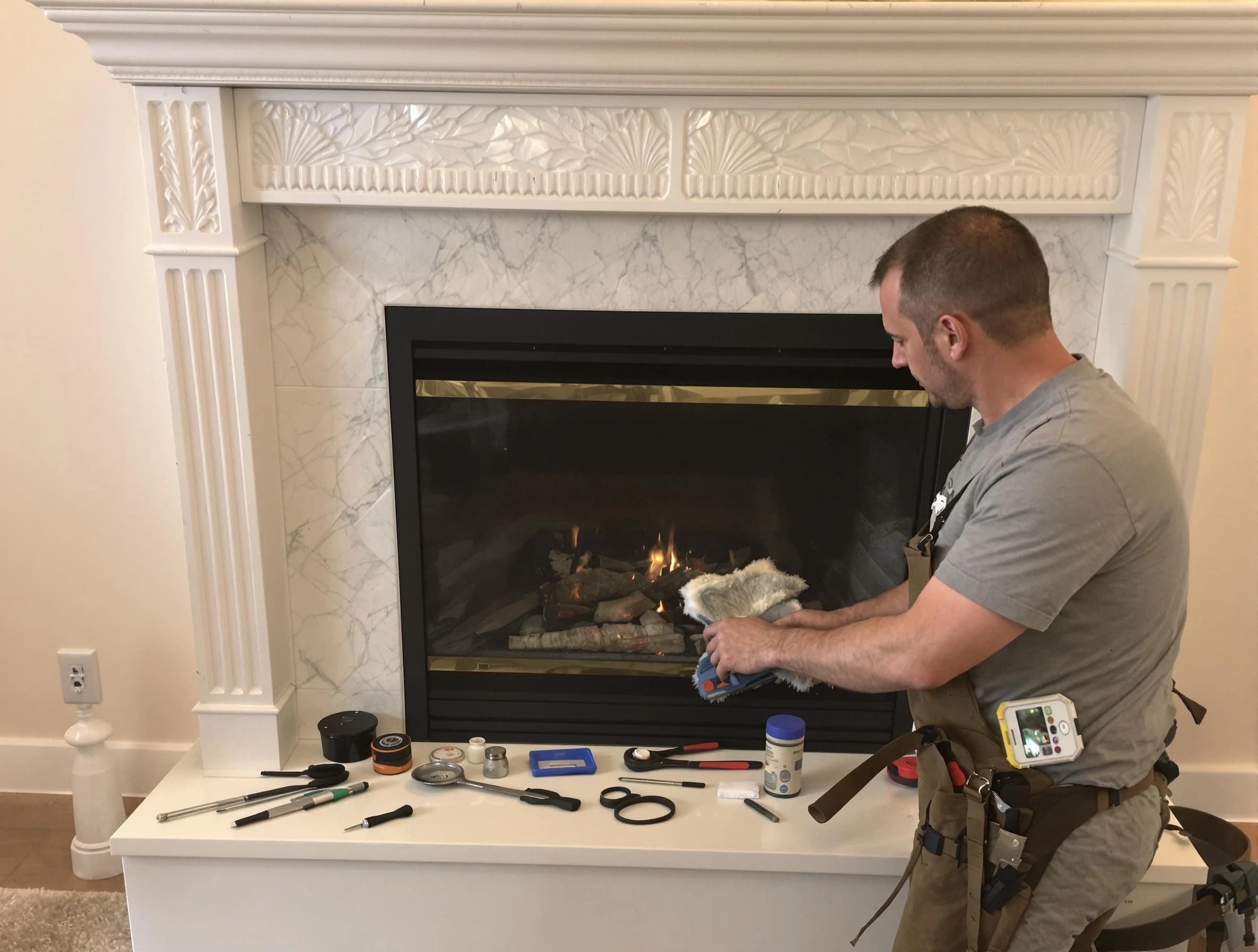 Framingham Chimney Sweep performing fireplace maintenance in Framingham, MA